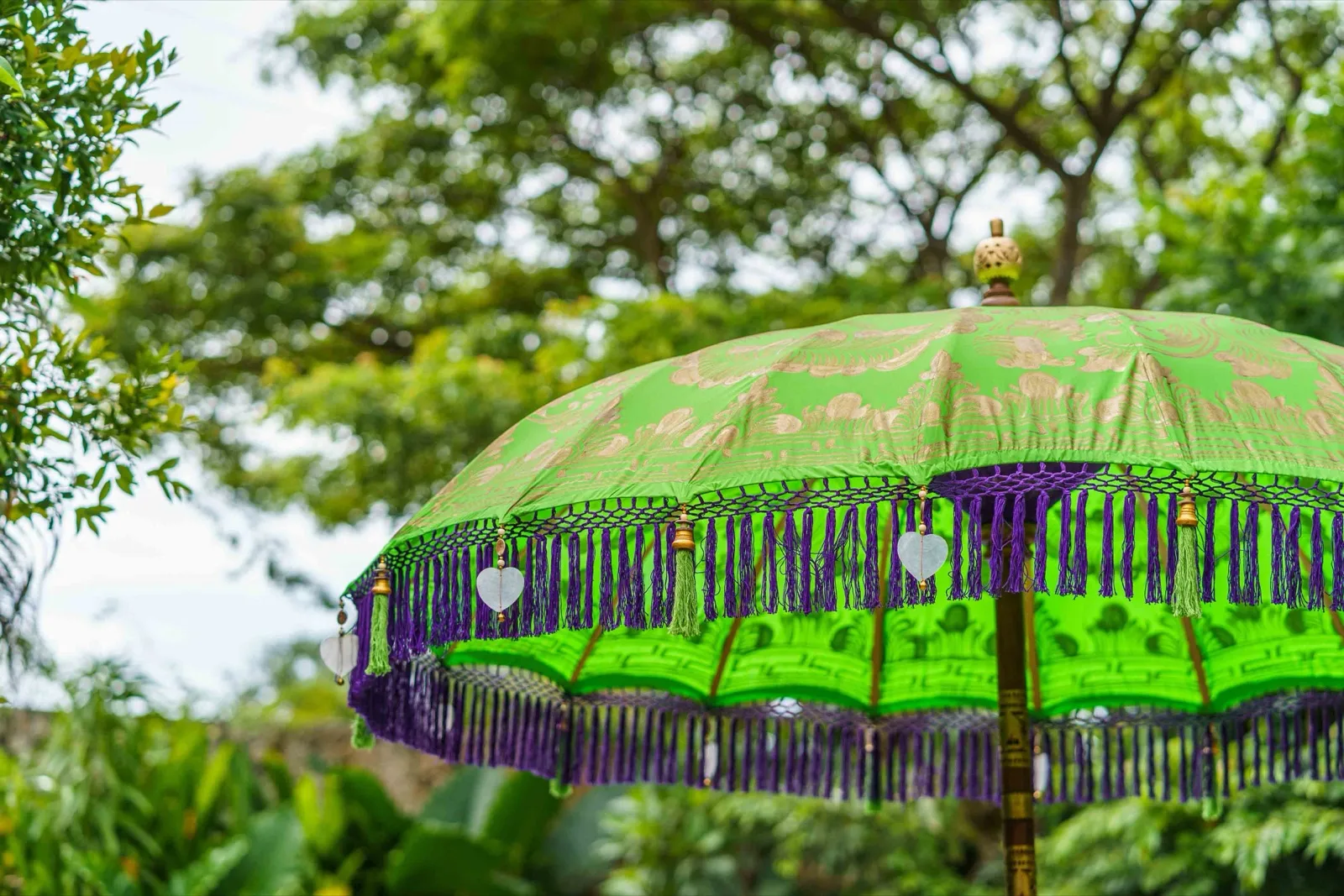 Green Lavender Bali umbrella · Deep green · violet tassel fringe