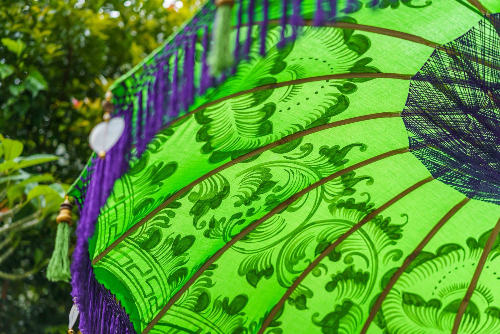 Green Lavender Bali umbrella · Deep green · violet tassel fringe