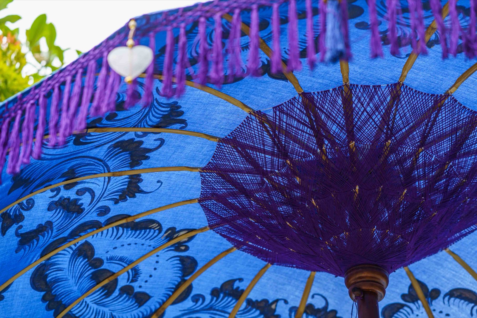Lapis Bali umbrella · Lapis navy · gold motif · twin-toned fringe